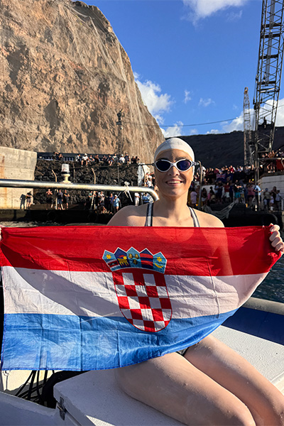 Dina holding a Croatia flag