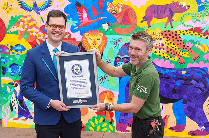 Adjudicator and ZSL employee with the artwork