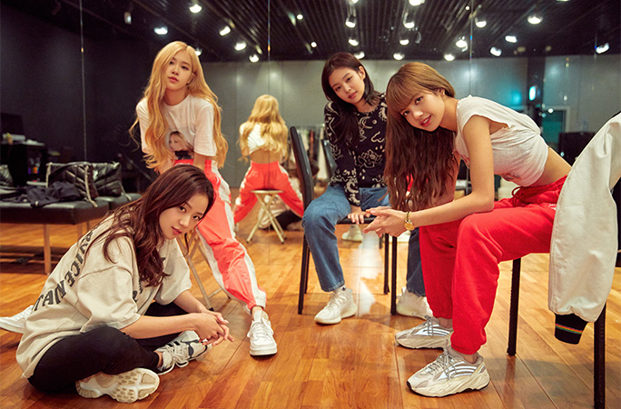 BLACKPINK posing in a dance studio