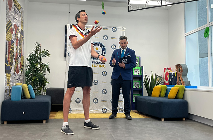 Fabian juggling while GWR's Will Munford watches