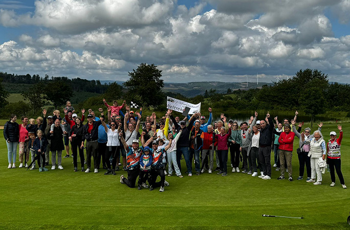 with a crowd of people on the green