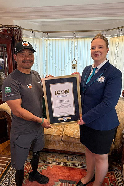 Hari getting his ICON certificate from GWR Adjudcator Emma Salt