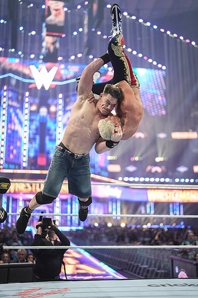 John Cena performing his attitude adjustment move on Cody Rhodes