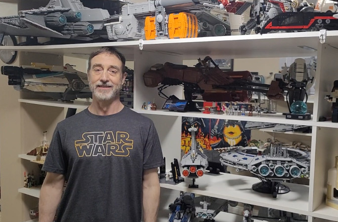 Fred standing in front of his LEGO collection