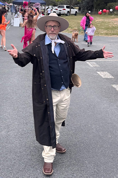 Joseph working as a town crier at an event