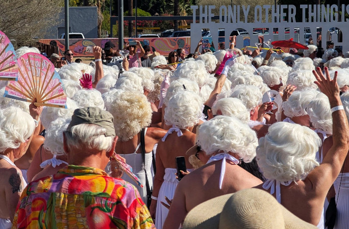 The crowd from the back, so you can only see a sea of blonde wigs