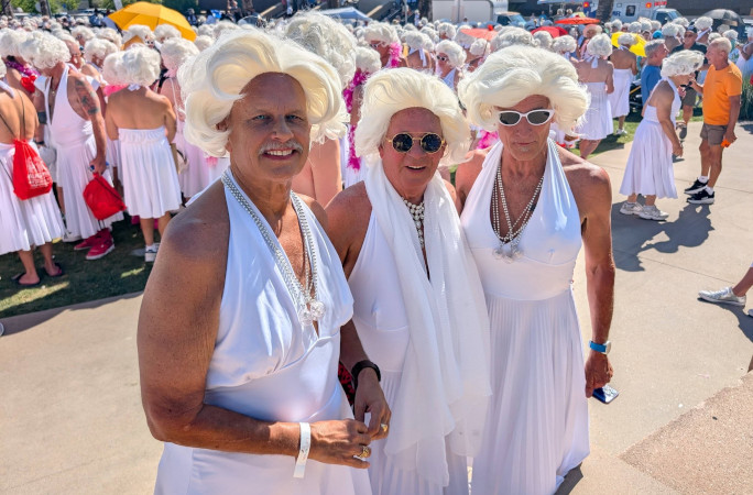Three people dressed as Marilyn posing for a pic