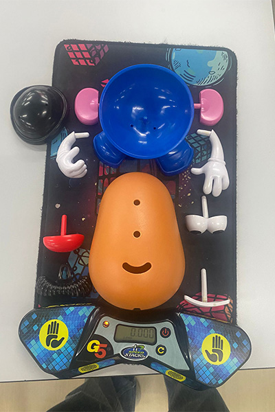 a disassembled Mr. Potato Head toy