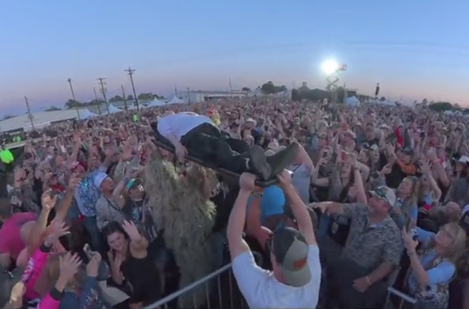 Pauline being lifted above the crowd