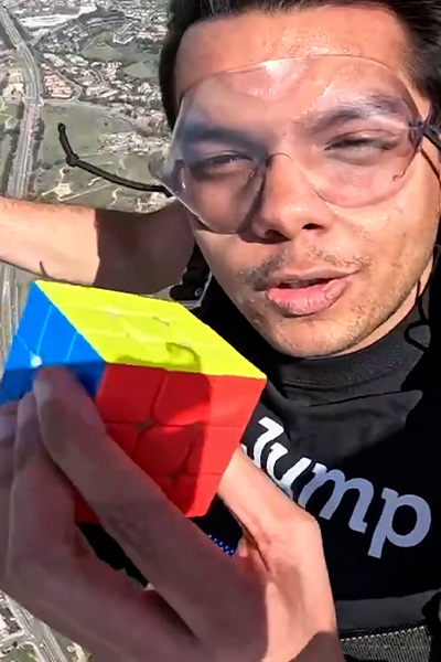 Ishaan holding up a cube