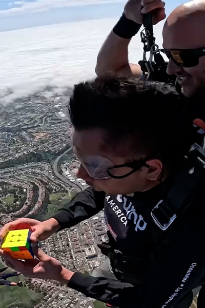 Ishaan with a solved cube