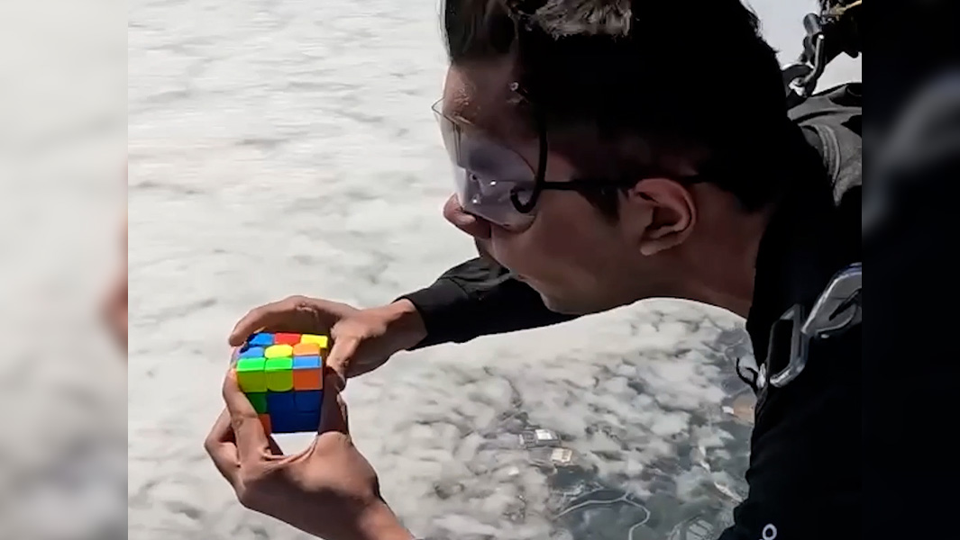 split image of Ishaan solving puzzle cubes while skydiving