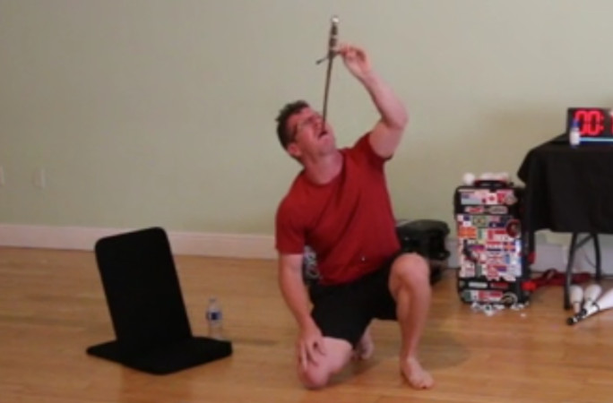 Noah removing the sword from his mouth
