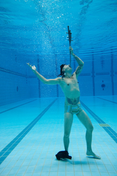 Chayne preparing to swallow a sword underwater