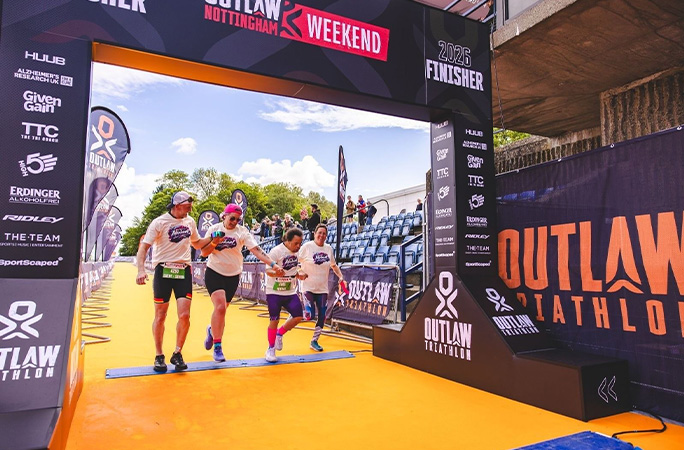 Michael crossing the finish line