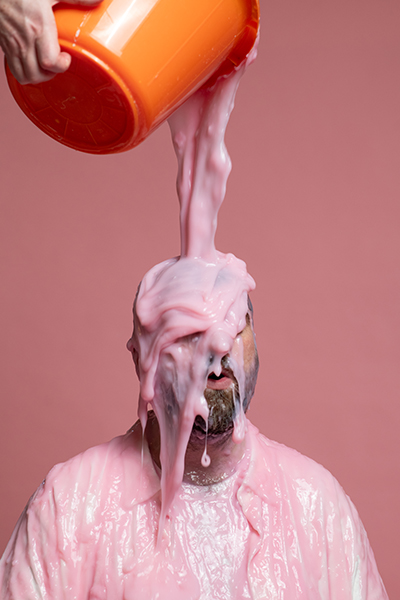 A bucket of pink slime being poured over Pictish Trail