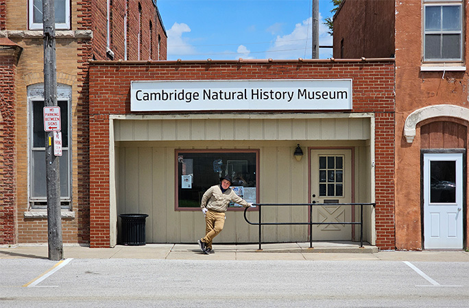 Anderson posing outside museum
