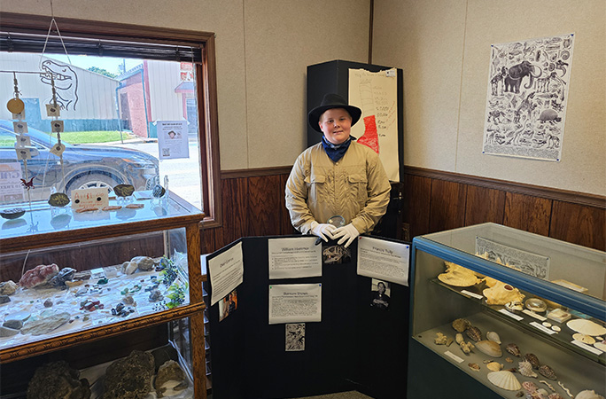 Anderson posing inside museum