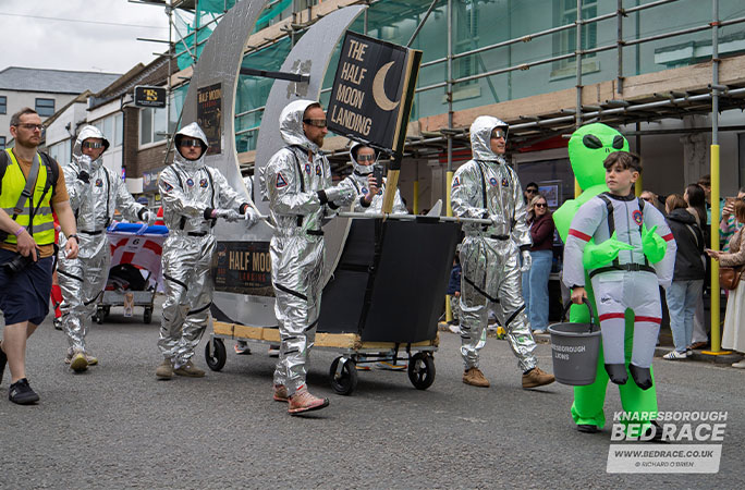 bed race team dressed as astronauts and aliens