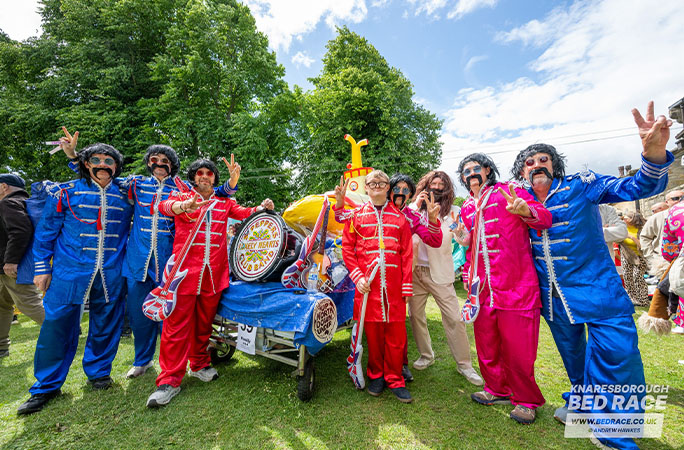 bed race team dressed as The Beatles