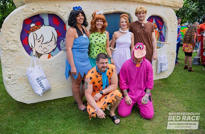 bed race team dressed as The Flintstones