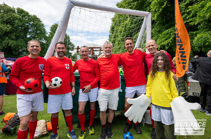 bed race team dressed as footballers