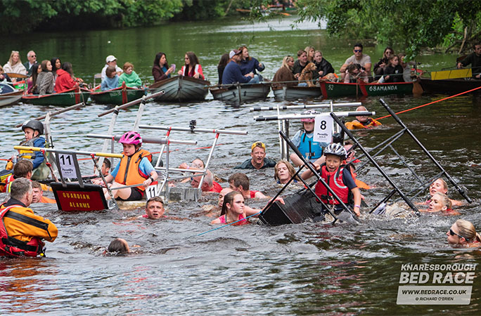 bed race teams in the water
