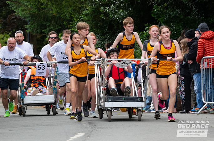 bed race teams running