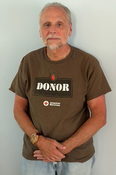 Recent picture of Dan wearing his Donor t shirt