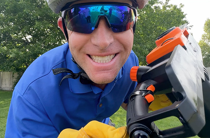 David posing with a chainsaw