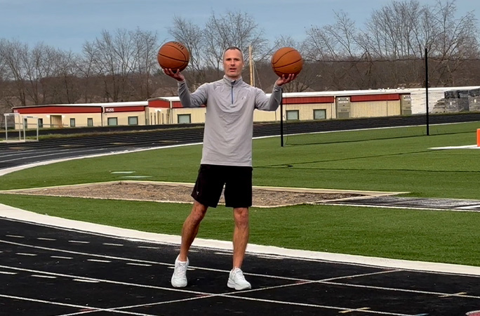 Michael holding basketballs