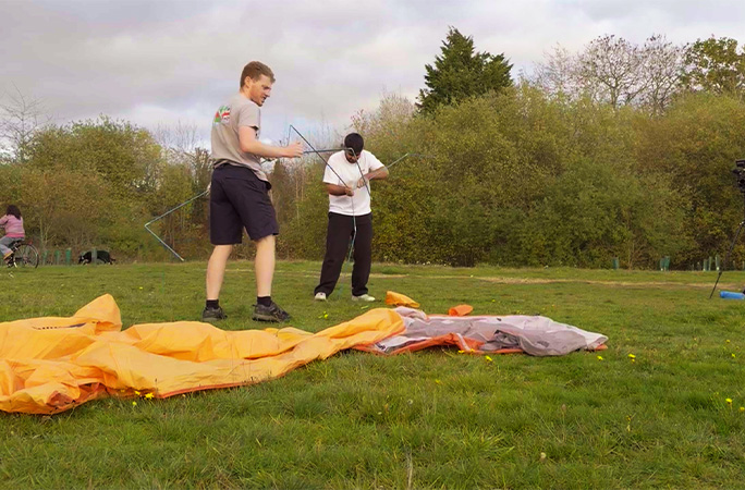 Param and Adam assembling tent poles