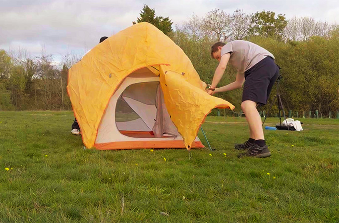 Param and Adam building the tent