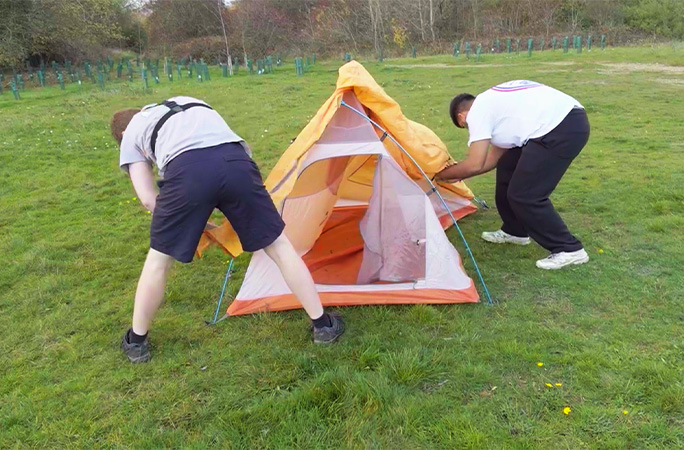 Param and Adam building the tent