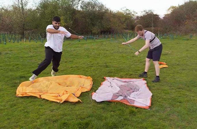 Param and Adam building the tent