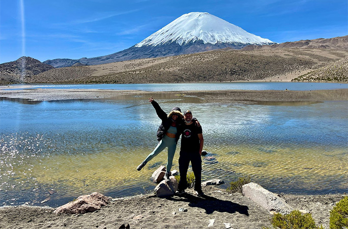 Carlos and Laura posing in front of the volcano