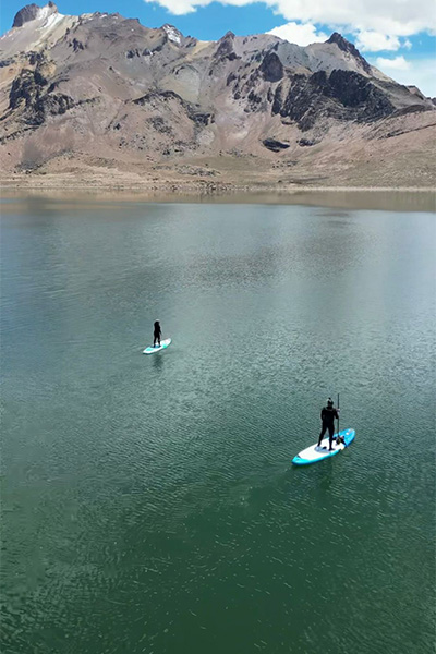 the couple paddleboarding