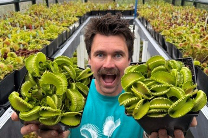 jeremish-harris-in-his-greenhouse-with-hundreds-of-different-varieties-of-venus-flytrap