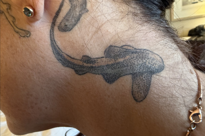Emily's neck tattoo