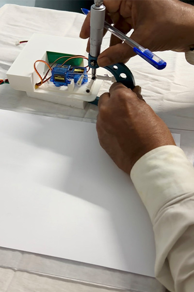 Hiten working on the robot arm
