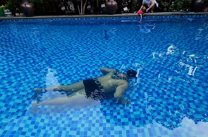 Kamal doing push ups under water