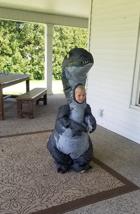 Young Anderson in dinosaur costume