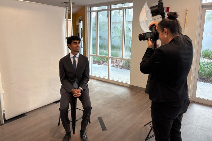 Nathan getting his photo taken by a photographer