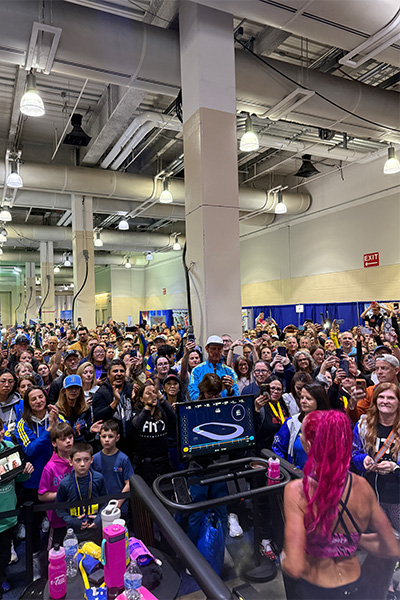 Crowd watching Ashley run on a treadmill