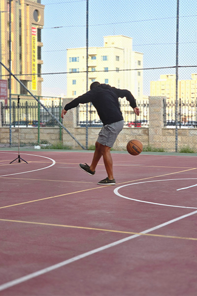 Hamed kicking a basketball with his heel