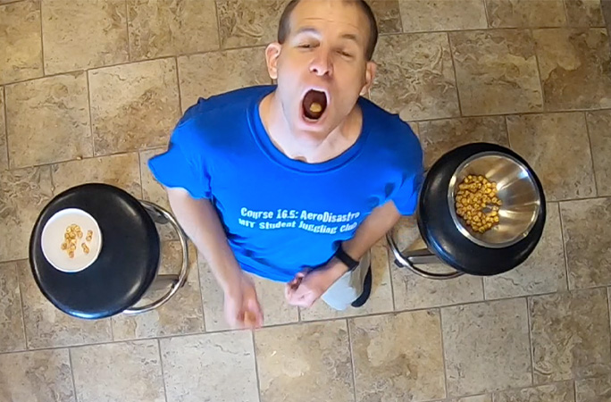 David catching popcorn in his mouth