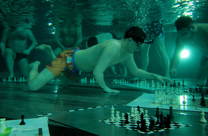 Michal playing chess underwater