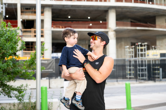 Eddy holding his son