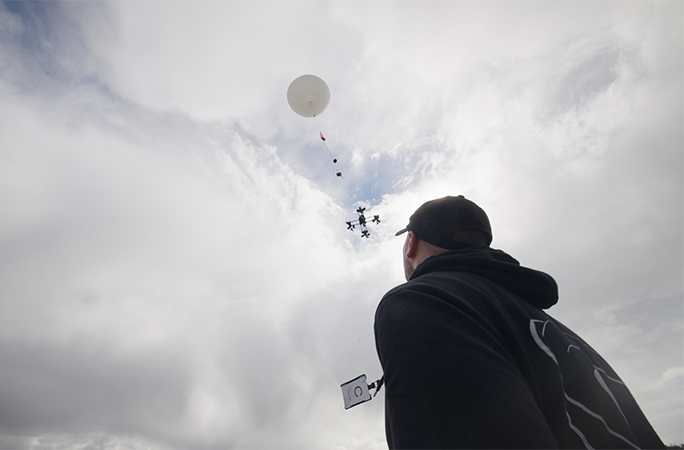 balloon carrying the phone up into the sky