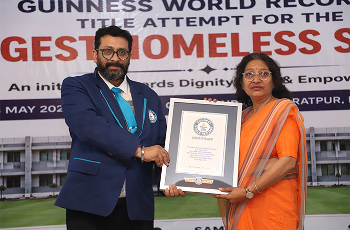 woman being presented with a GWR certificate